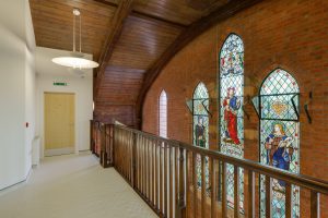 image-top-floor-landing-panacea-medical-center-featuring-stained-glass-mural